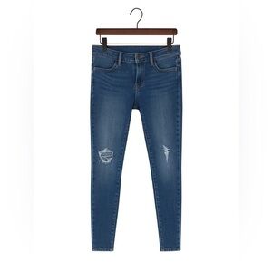 Articles of Society size 25 ripped skinny jeans with frayed bottoms.